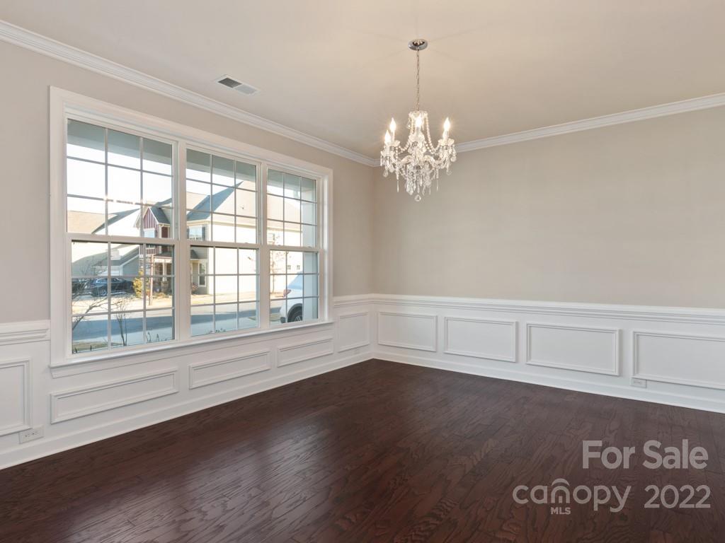 1335 Bryson Gap Drive Fort Mill, SC 29715 - Photo 4 of 29 an empty room with wooden floor and windows