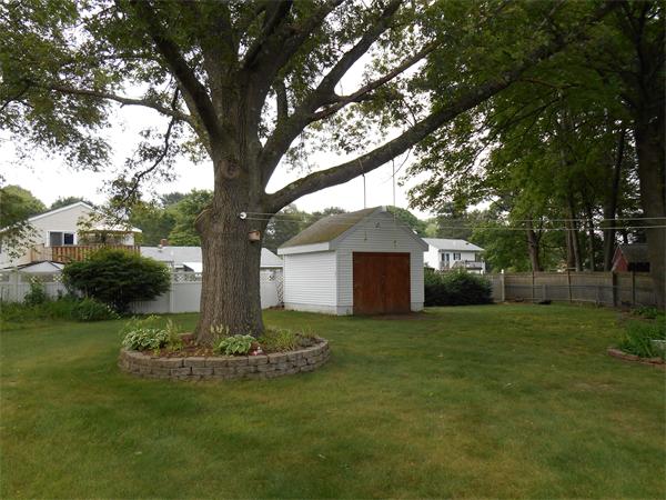 106 Lexington Road Billerica, MA 01821 - Photo 3 of 14 a front view of a house with a garden and trees