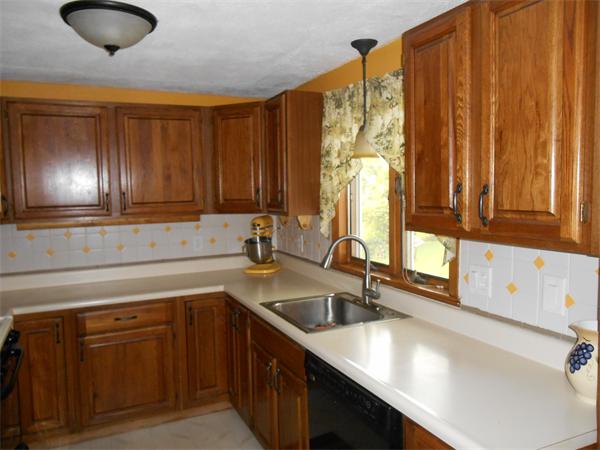 106 Lexington Road Billerica, MA 01821 - Photo 6 of 14 a kitchen with stainless steel appliances a sink window and cabinets