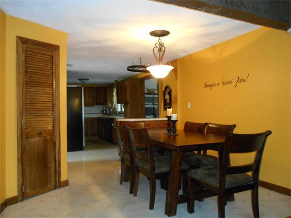 106 Lexington Road Billerica, MA 01821 - Photo 8 of 14 a view of a dining room and a table and chairs