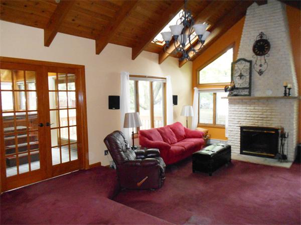 106 Lexington Road Billerica, MA 01821 - Photo 9 of 14 a living room with furniture a flat screen tv and a fireplace