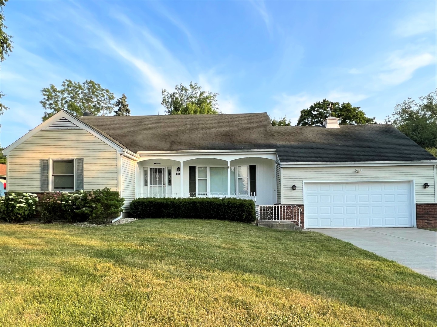 605 Old Orchard Road Harvard, IL 60033 - Photo 1 of 3 a front view of a house with a garden