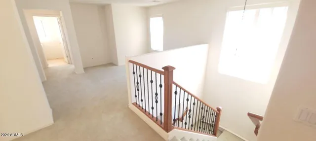 an empty room with a bathroom and a sink