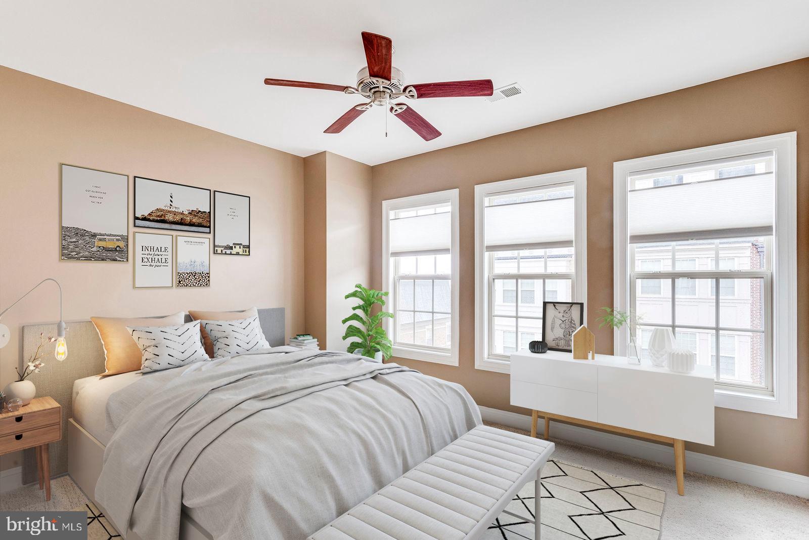 503 Rampart Way, Unit 16 Oxon Hill, MD 20745 - Photo 13 of 35 a bedroom with a large bed and a large window