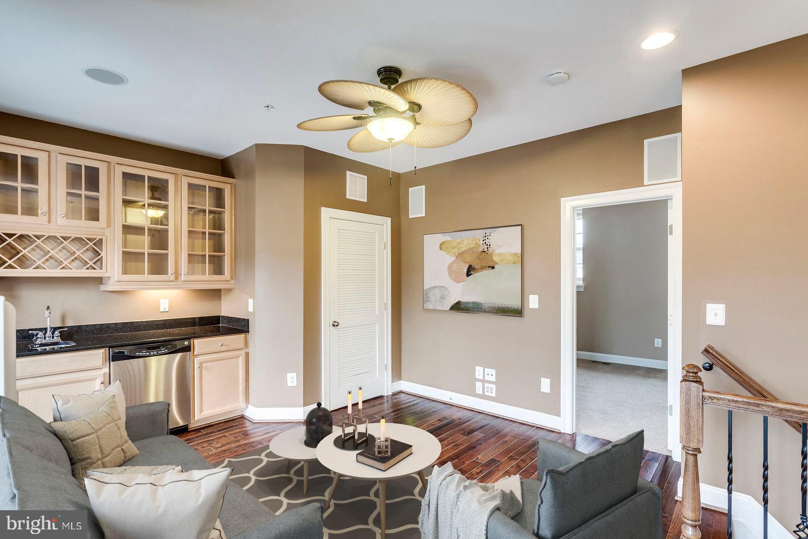 503 Rampart Way, Unit 16 Oxon Hill, MD 20745 - Photo 16 of 35 a living room with stainless steel appliances kitchen island granite countertop furniture and a large window