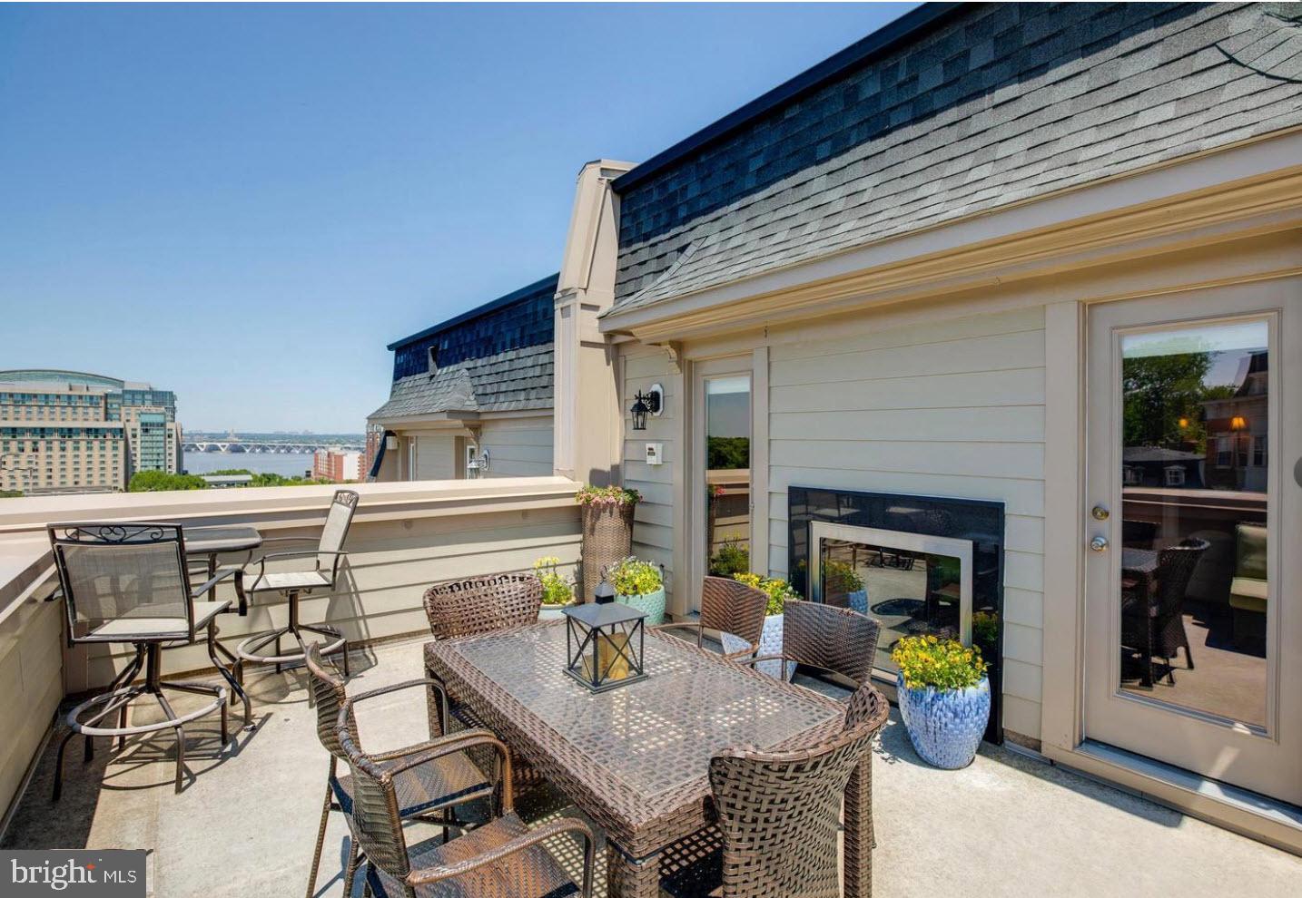 503 Rampart Way, Unit 16 Oxon Hill, MD 20745 - Photo 18 of 35 a view of a dinning tables and chairs in the patio
