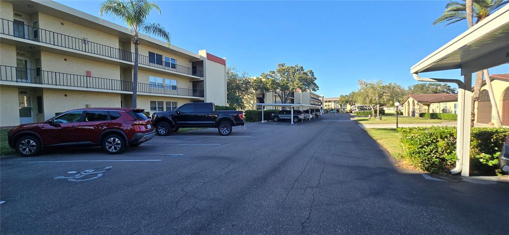 12200 Vonn Road, Unit 1305 Largo, FL 33774 - Photo 2 of 22 a view of a cars parked in front of a building