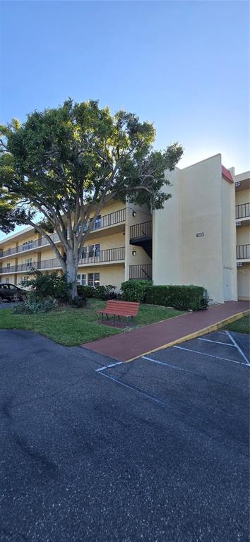 12200 Vonn Road, Unit 1305 Largo, FL 33774 - Photo 3 of 22 a view of a house with a yard