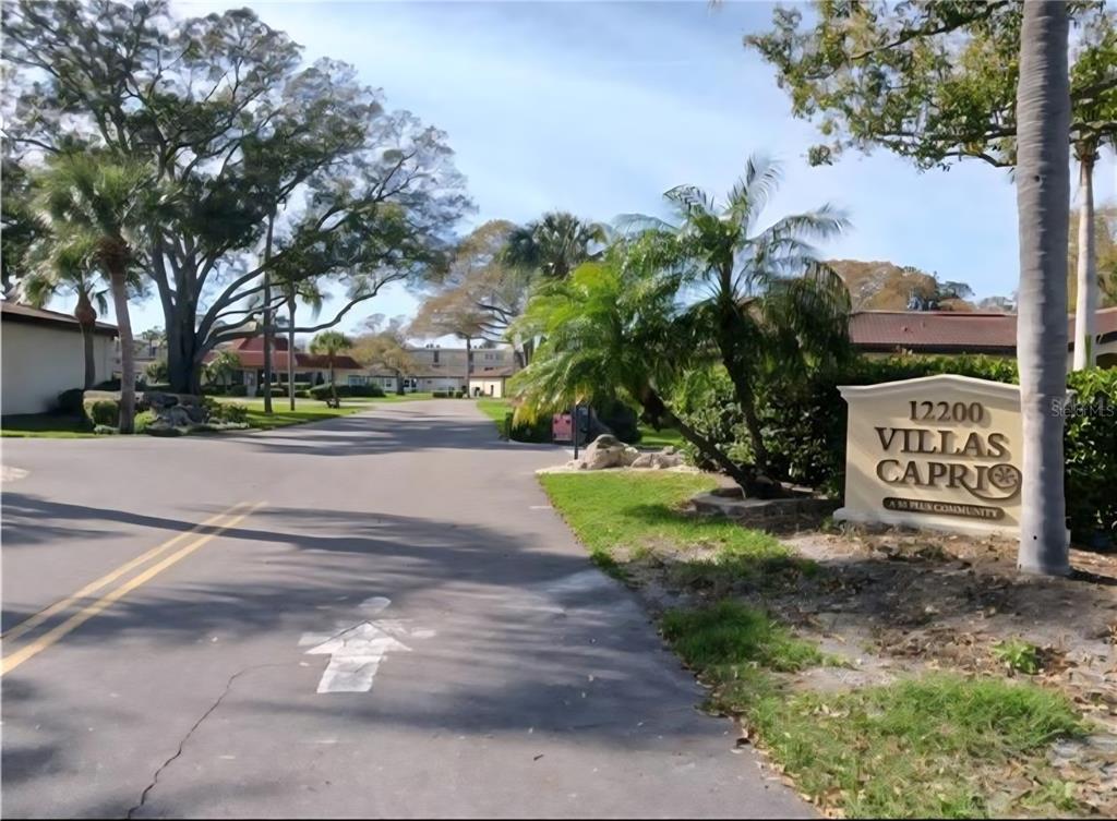 12200 Vonn Road, Unit 1305 Largo, FL 33774 - Photo 6 of 22 a view of a street with a building and a street sign