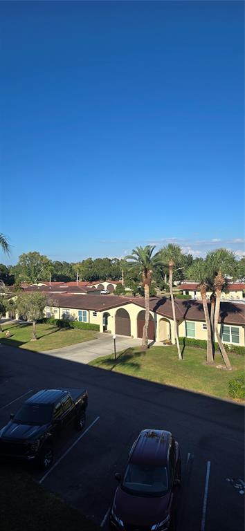 12200 Vonn Road, Unit 1305 Largo, FL 33774 - Photo 8 of 22 a view of swimming pool with outdoor seating