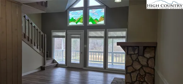 a view of entryway with wooden floor