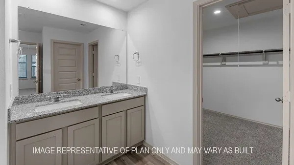 a bathroom with a granite countertop sink a mirror and a shower
