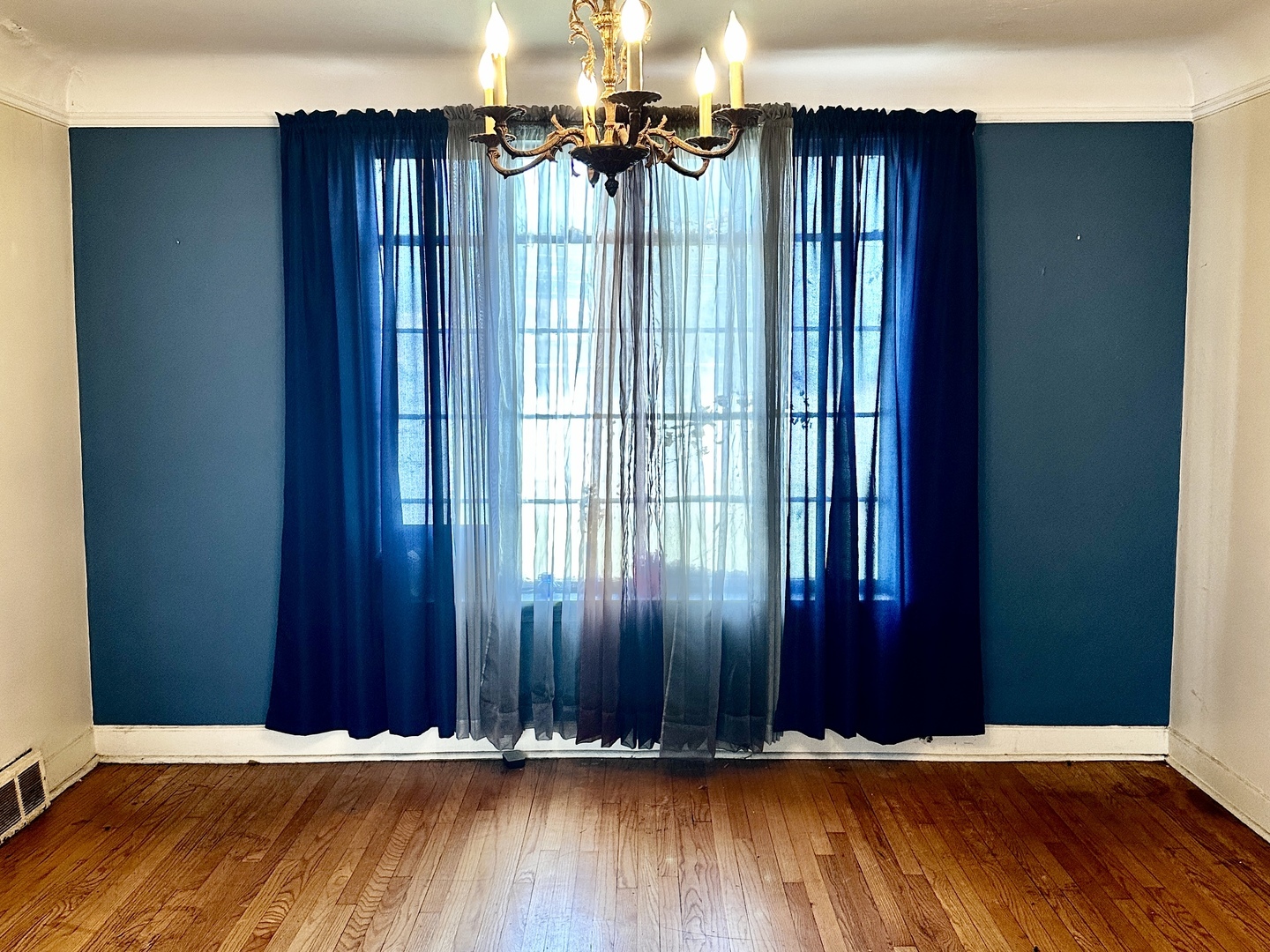 1706 East 83rd Street Chicago, IL 60617 - Photo 5 of 8 an empty room with wooden floor and windows