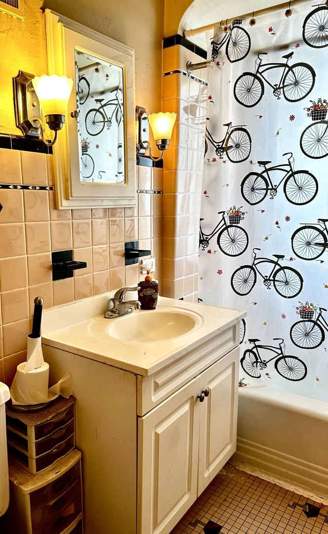 1706 East 83rd Street Chicago, IL 60617 - Photo 8 of 8 a kitchen with a sink and a stove