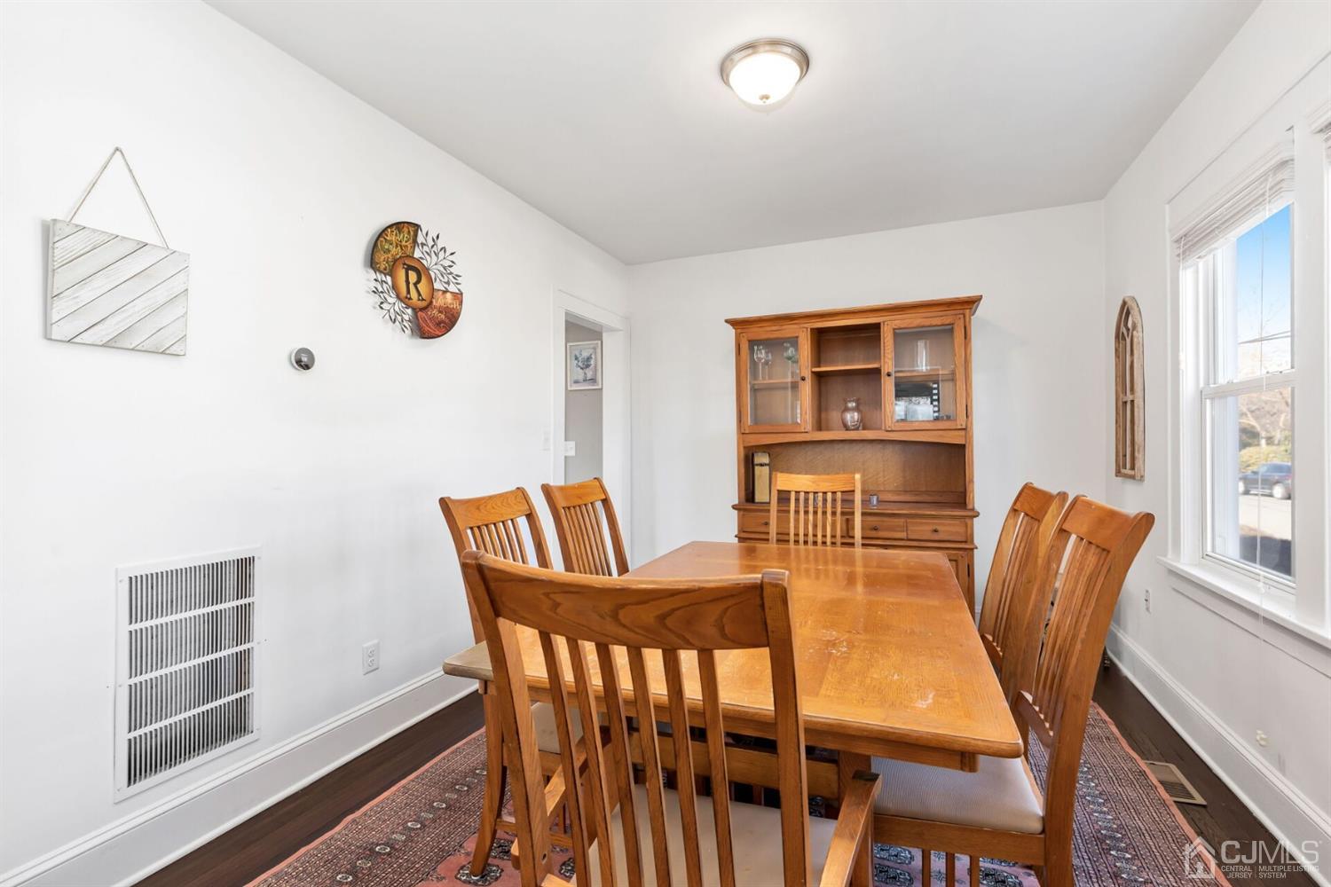323 Washington Road Sayreville, NJ 08872 - Photo 13 of 40 a view of a dining room with furniture and wooden floor