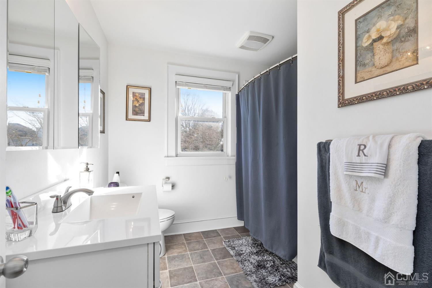 323 Washington Road Sayreville, NJ 08872 - Photo 23 of 40 a bathroom with a sink toilet and shower