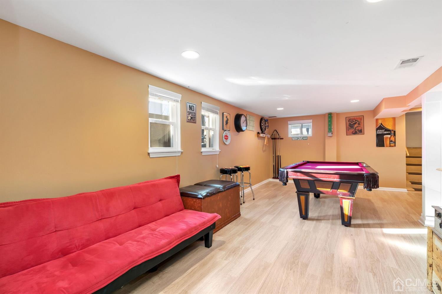 323 Washington Road Sayreville, NJ 08872 - Photo 28 of 40 a living room with furniture and a wooden floor