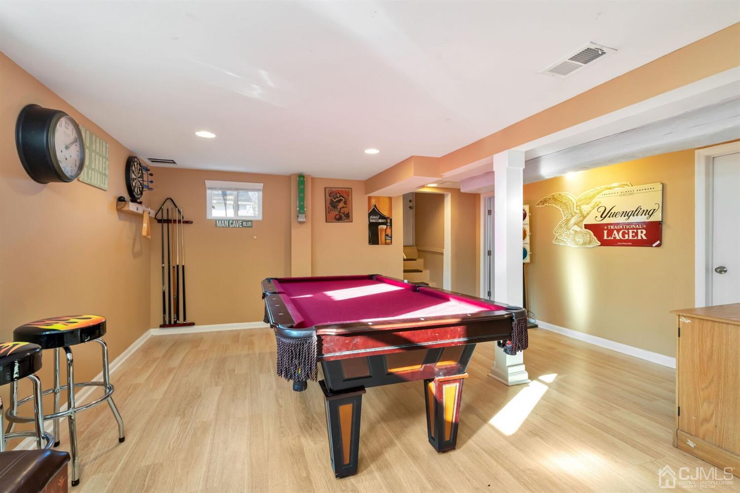 323 Washington Road Sayreville, NJ 08872 - Photo 29 of 40 a chandelier with a table and chairs