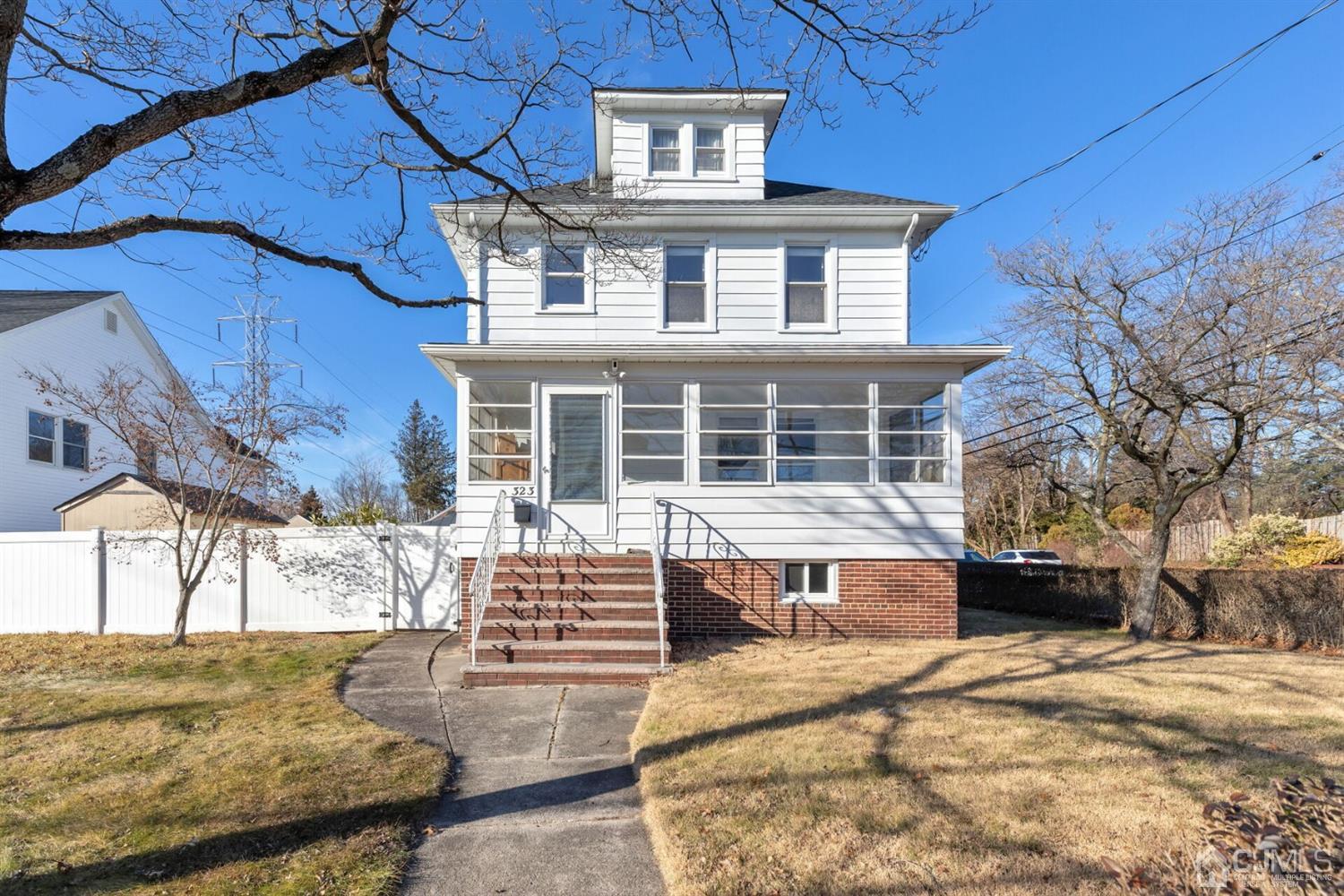 323 Washington Road Sayreville, NJ 08872 - Photo 32 of 40 a front view of a house with a yard
