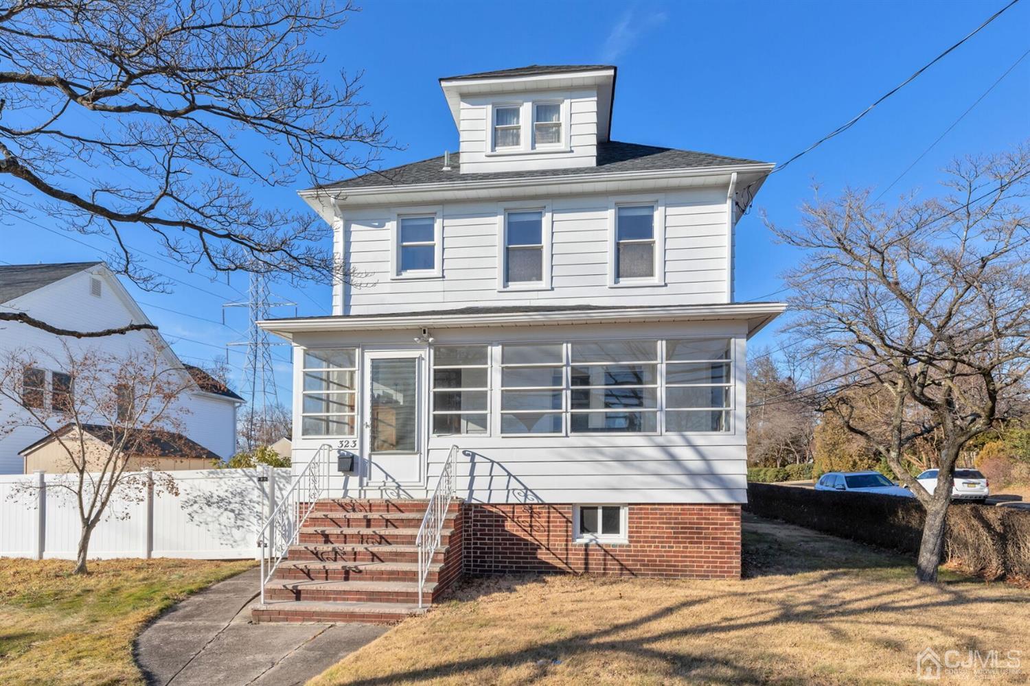 323 Washington Road Sayreville, NJ 08872 - Photo 36 of 40 a front view of a house with a yard