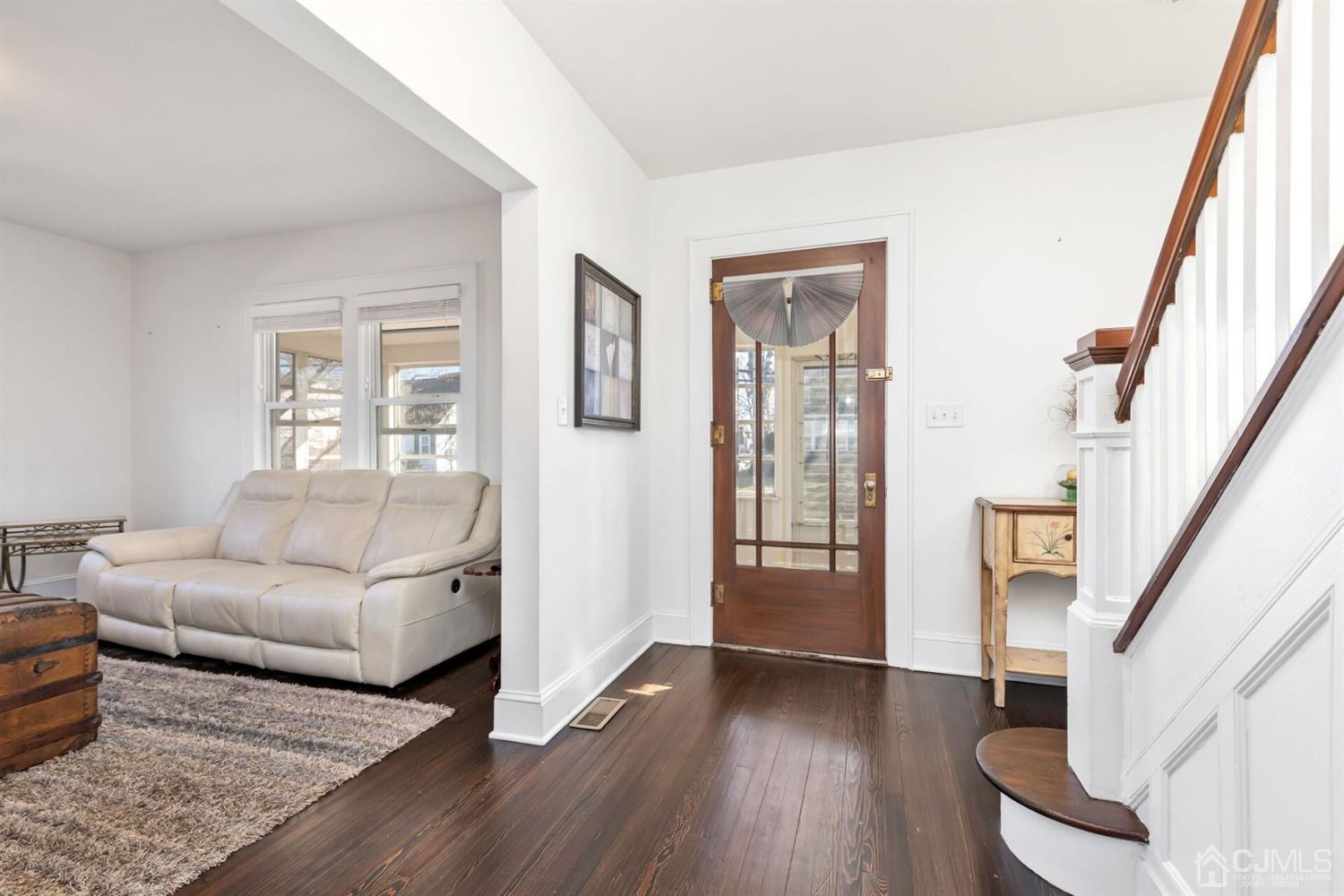 323 Washington Road Sayreville, NJ 08872 - Photo 6 of 40 a living room with furniture and a fireplace