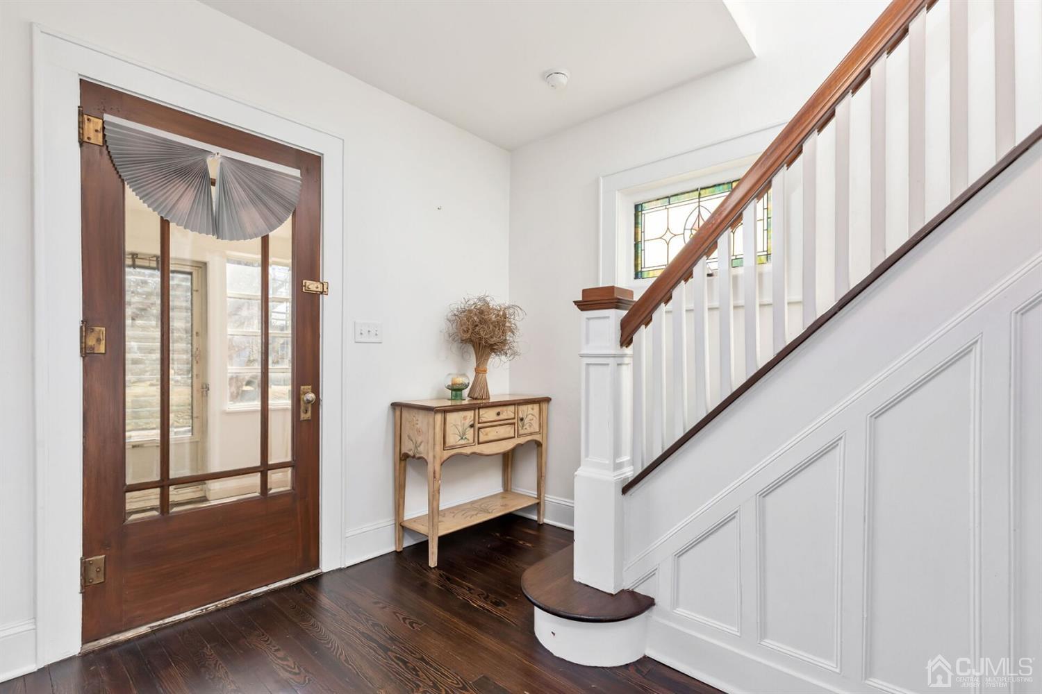 323 Washington Road Sayreville, NJ 08872 - Photo 7 of 40 a view of entryway with wooden floor and stairs