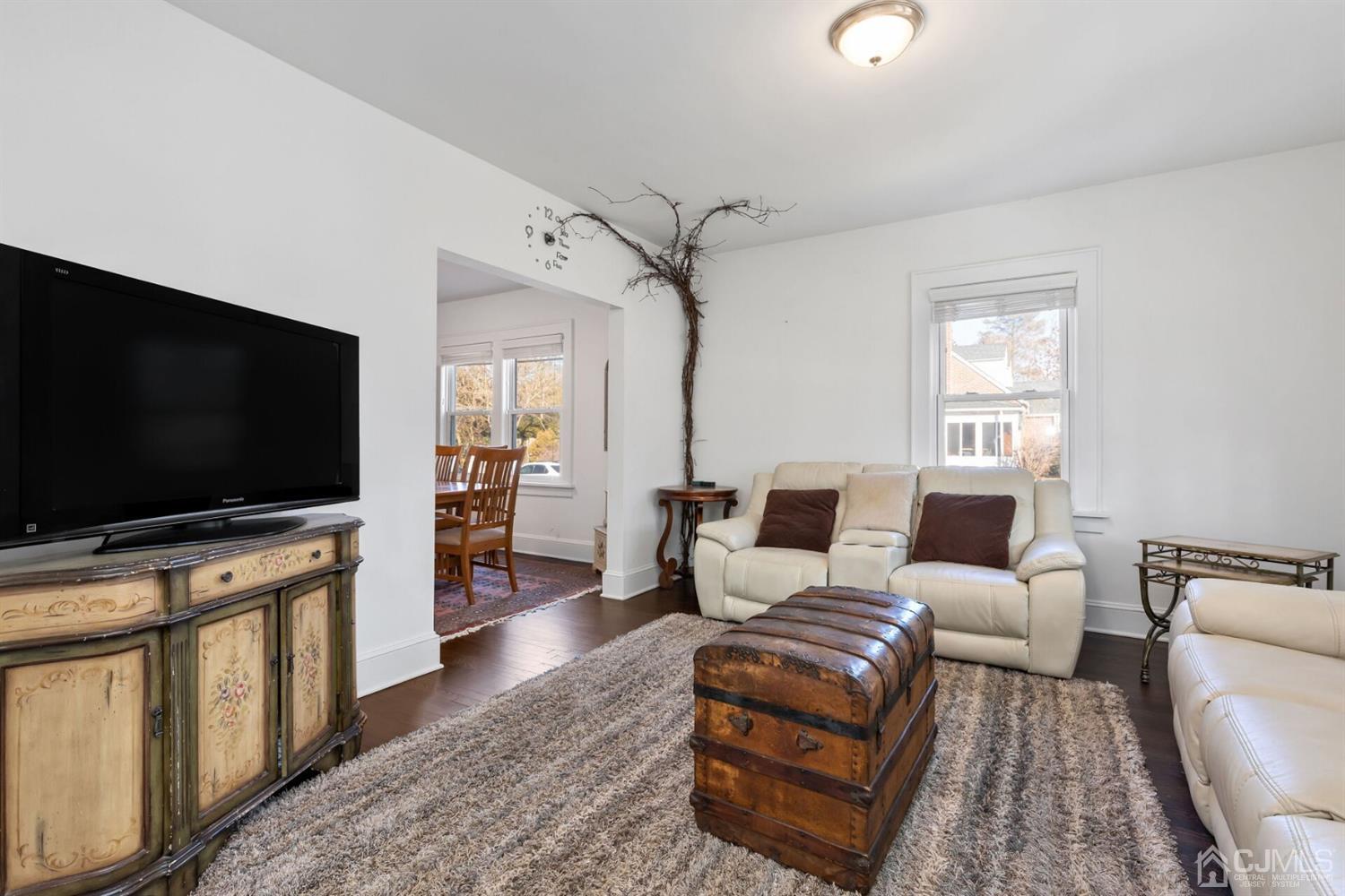 323 Washington Road Sayreville, NJ 08872 - Photo 8 of 40 a living room with furniture and a flat screen tv