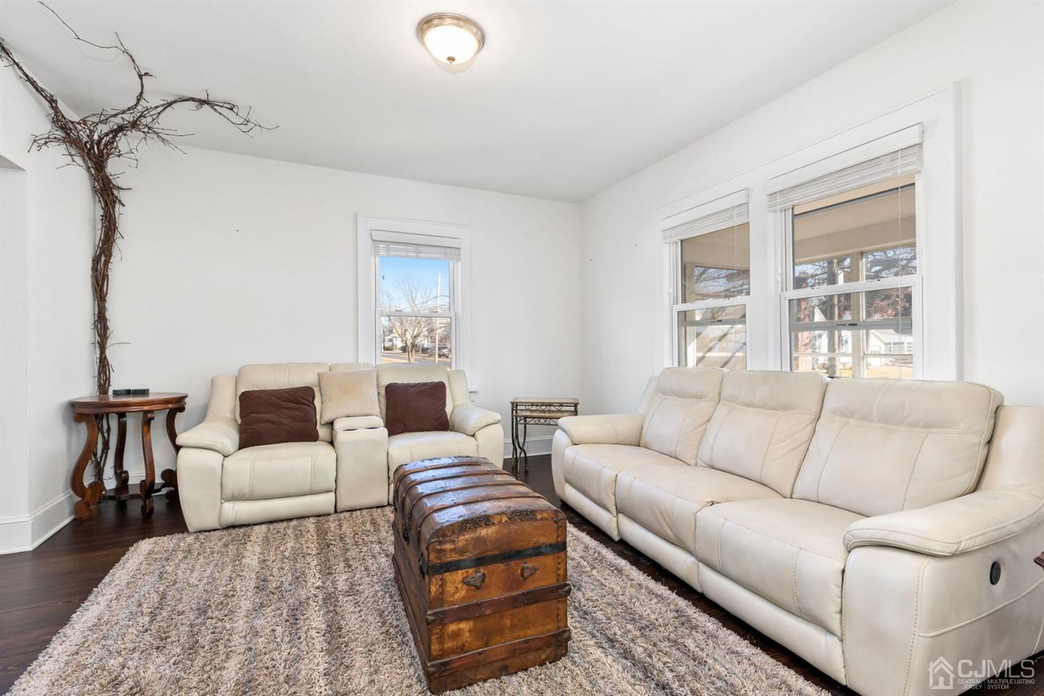 323 Washington Road Sayreville, NJ 08872 - Photo 9 of 40 a living room with furniture a bed and a table