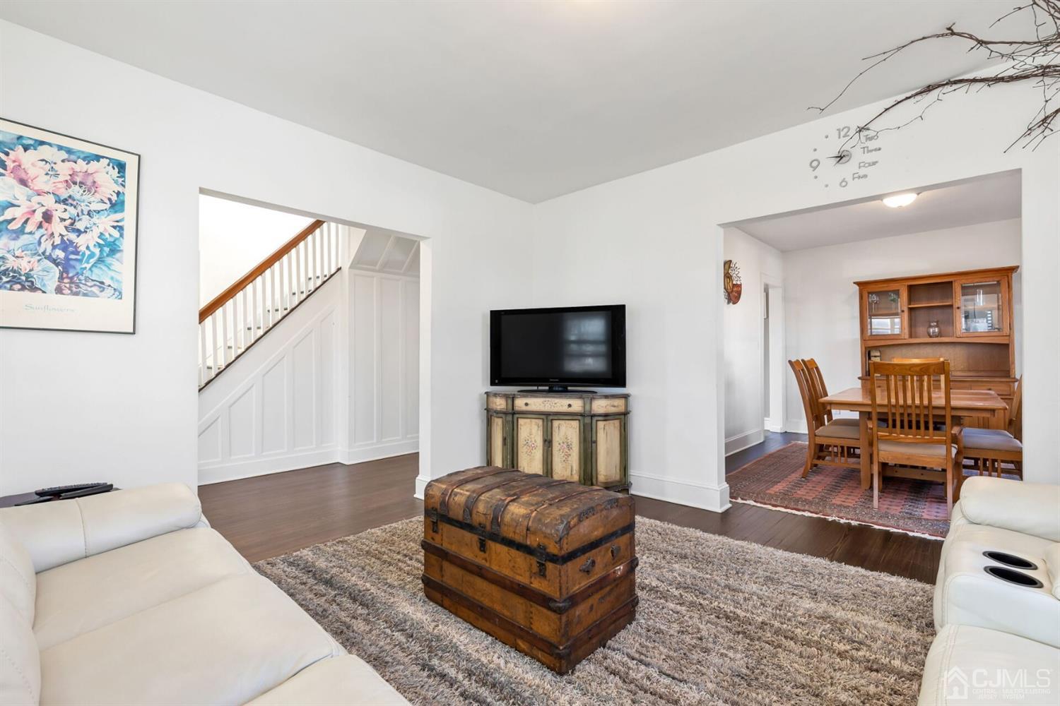 323 Washington Road Sayreville, NJ 08872 - Photo 10 of 40 a living room with furniture and a flat screen tv