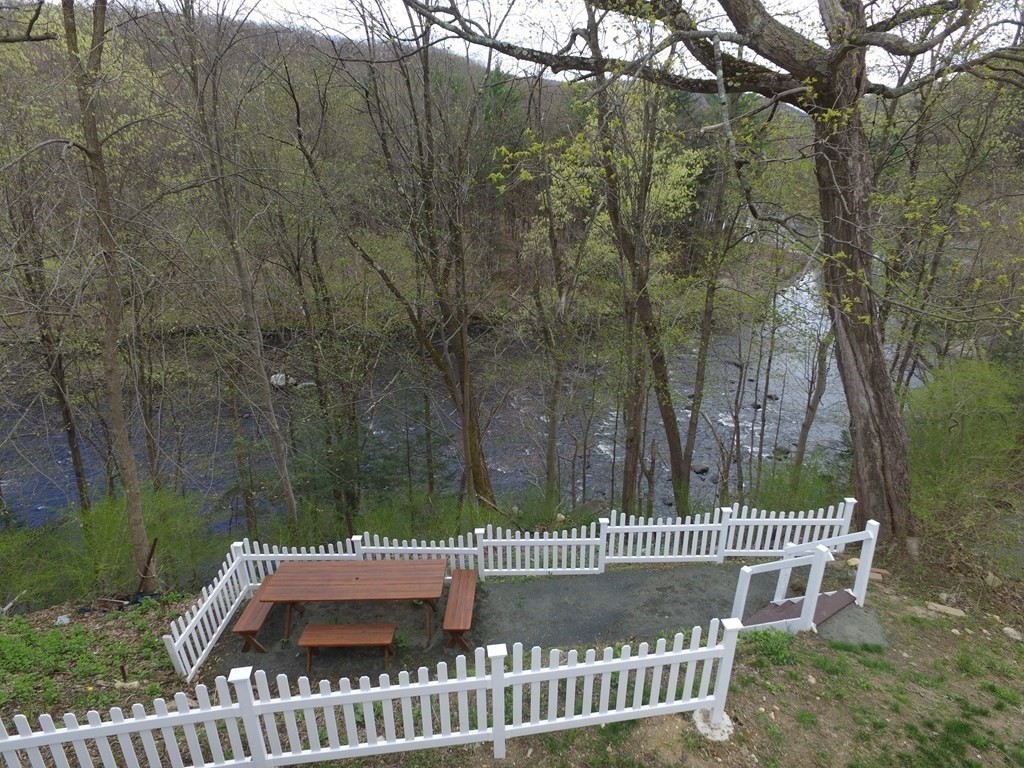 1104 Huntington Road Russell, MA 01071 - Photo 3 of 30 a view of a deck with a fence