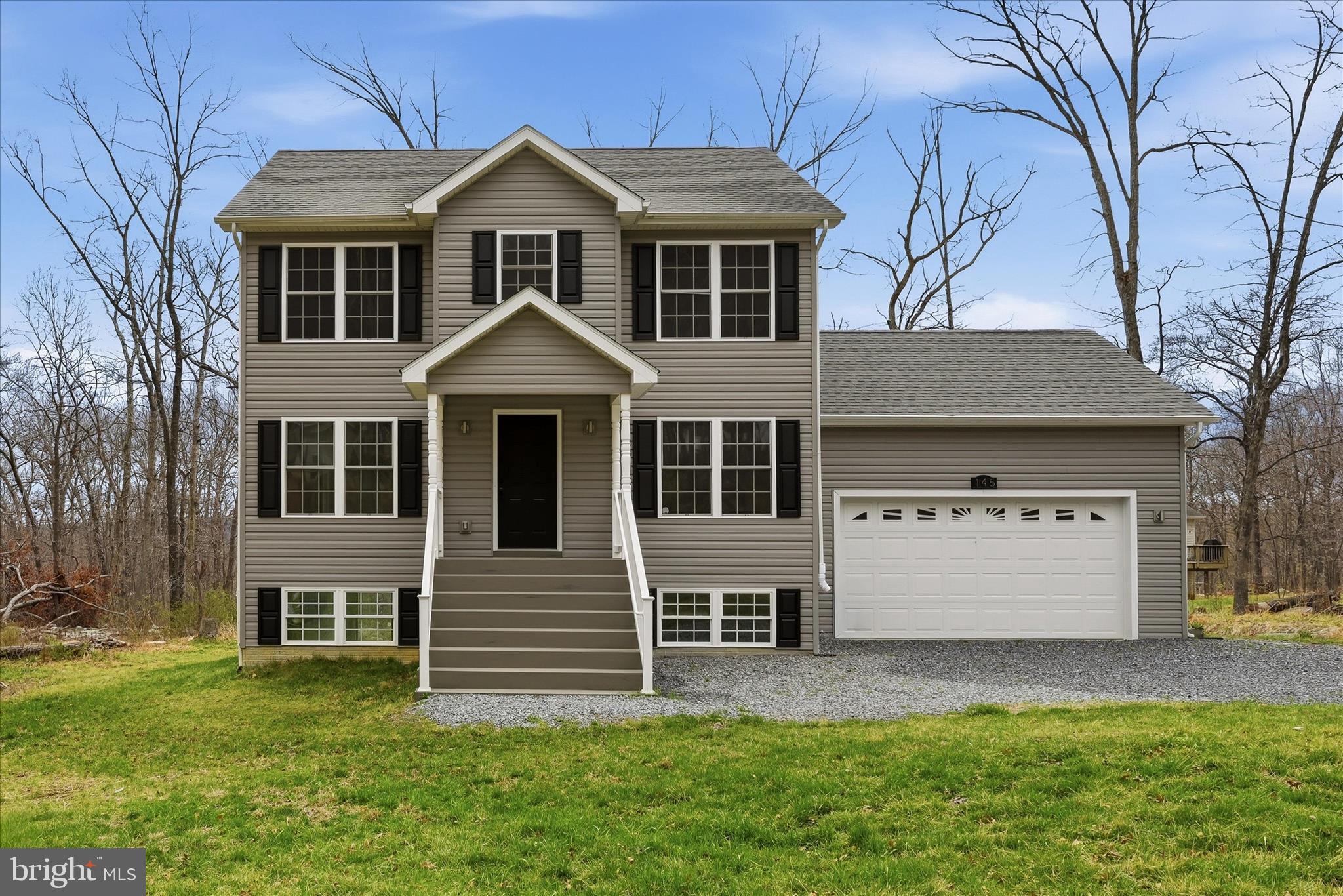 145 Graywolf Trail Winchester, VA 22602 - Photo 1 of 56 a front view of a house with a yard