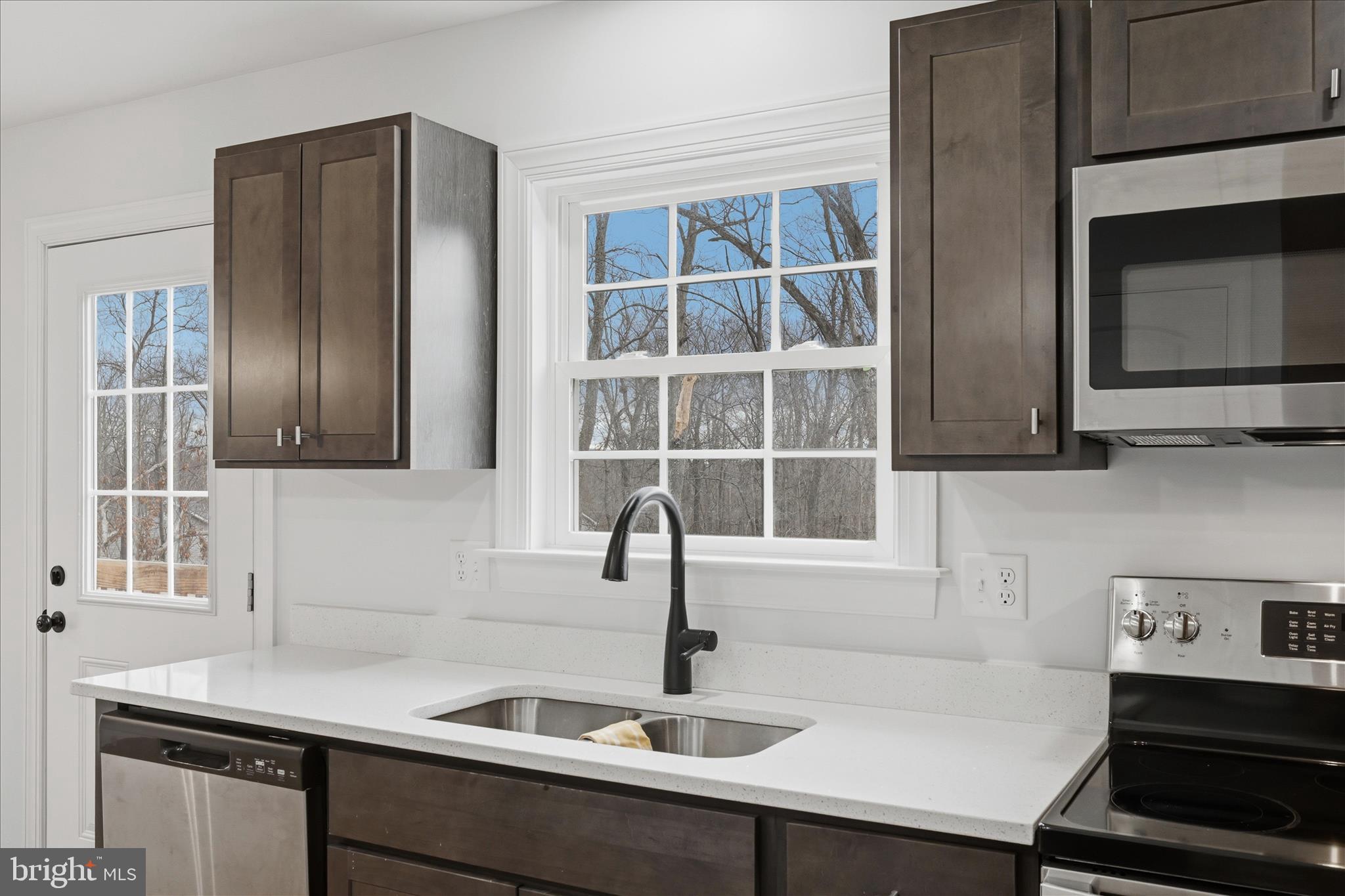 145 Graywolf Trail Winchester, VA 22602 - Photo 12 of 56 a kitchen with a sink and a window