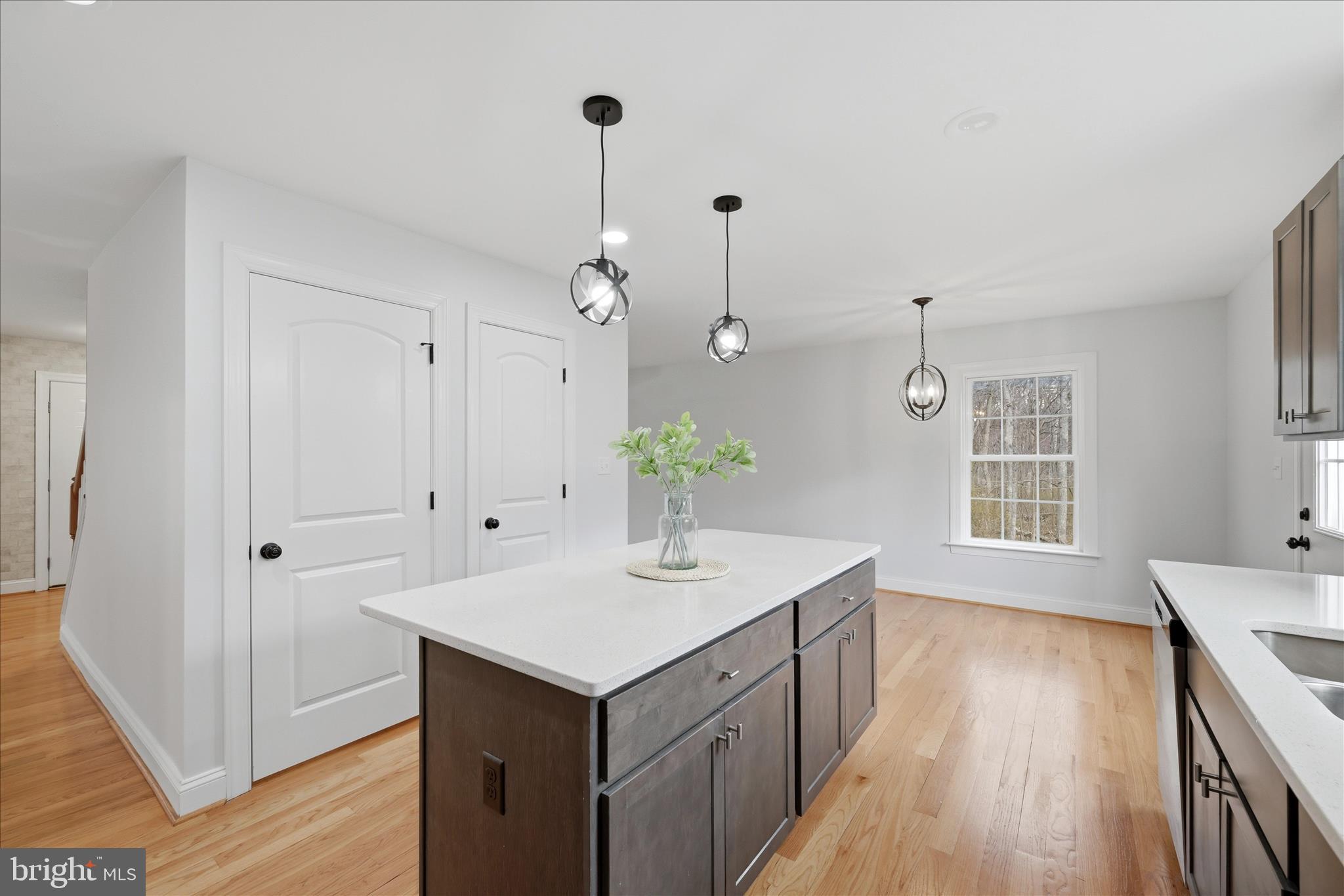 145 Graywolf Trail Winchester, VA 22602 - Photo 13 of 56 a kitchen with a sink and wooden floor