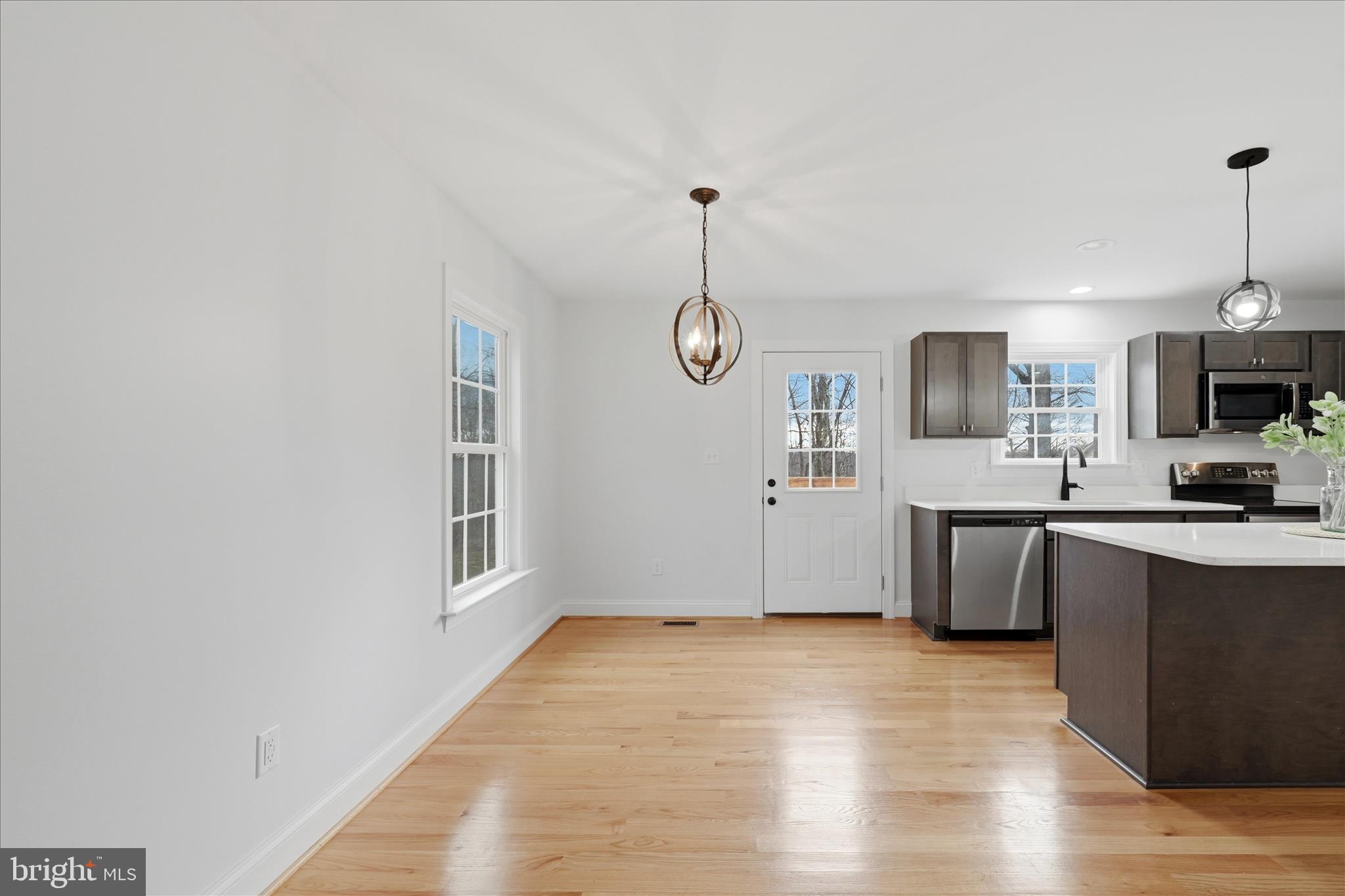 145 Graywolf Trail Winchester, VA 22602 - Photo 14 of 56 a view of a kitchen with a sink cabinets and wooden floor