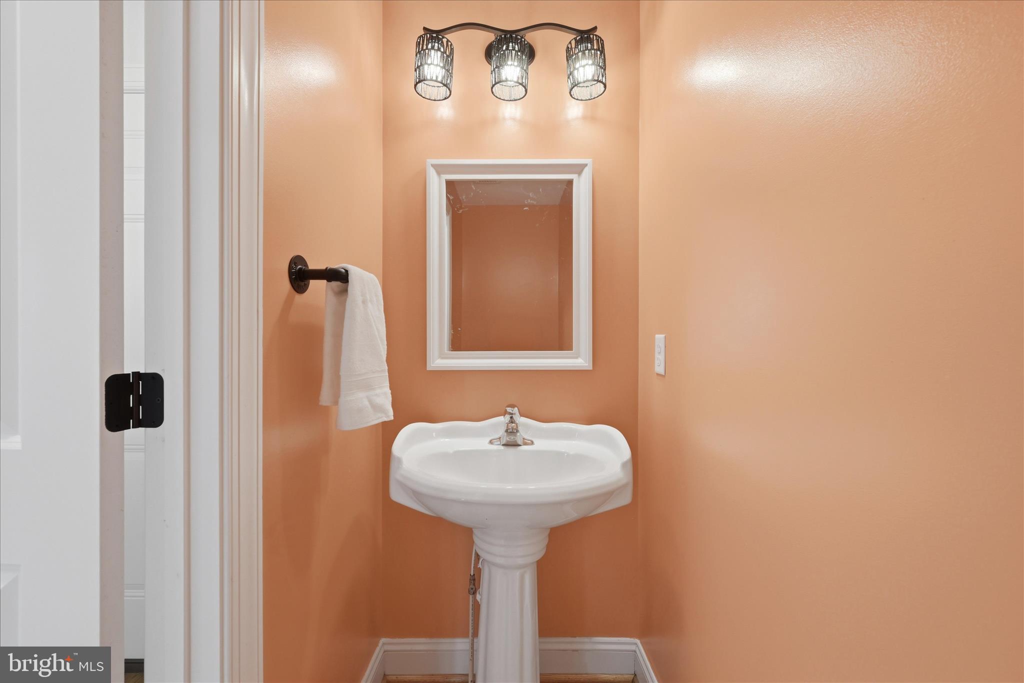 145 Graywolf Trail Winchester, VA 22602 - Photo 19 of 56 a bathroom with a sink and a mirror