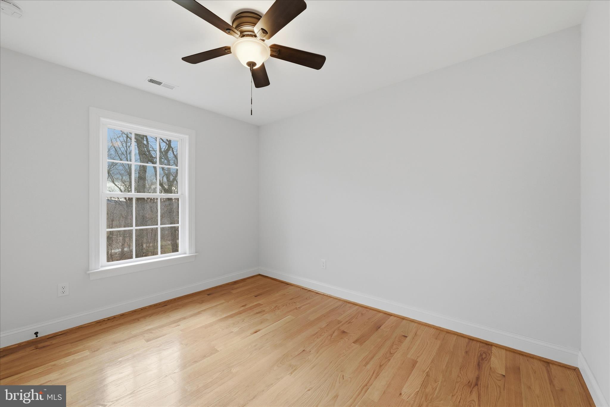 145 Graywolf Trail Winchester, VA 22602 - Photo 30 of 56 an empty room with a window and a ceiling fan