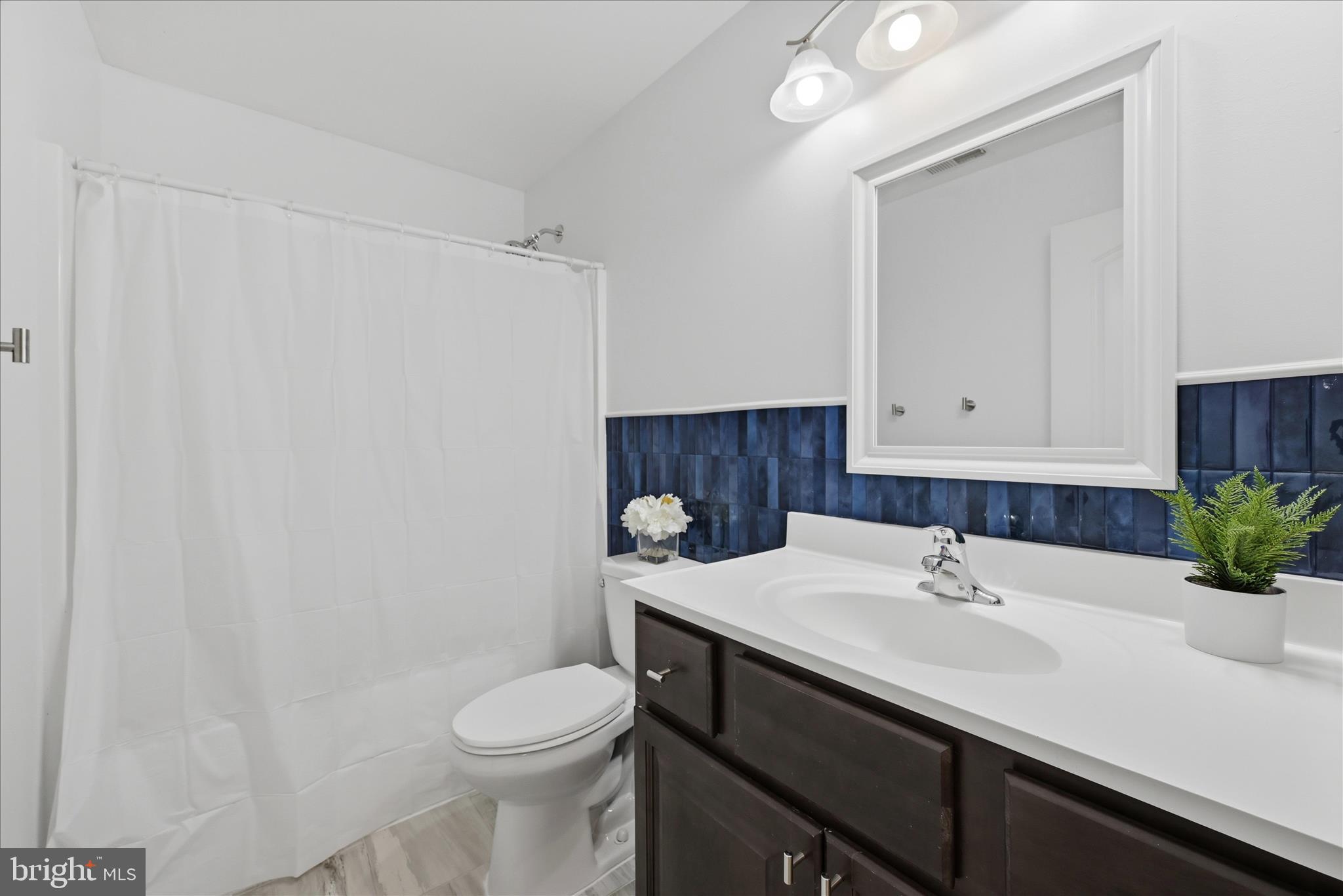 145 Graywolf Trail Winchester, VA 22602 - Photo 32 of 56 a bathroom with a sink toilet and vanity