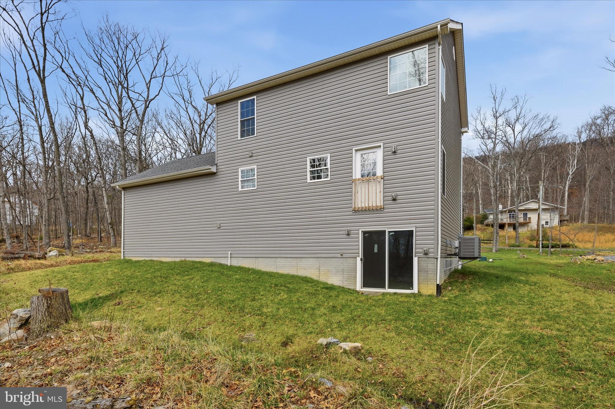 145 Graywolf Trail Winchester, VA 22602 - Photo 46 of 56 a view of a backyard with large tree