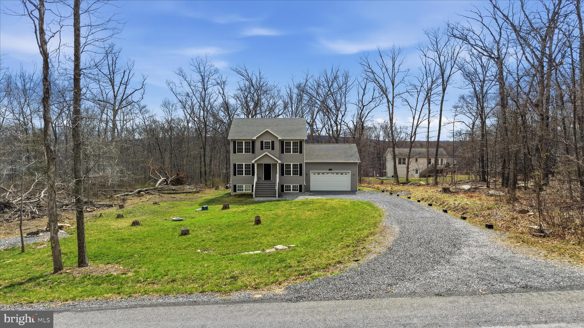 145 Graywolf Trail Winchester, VA 22602 - Photo 52 of 56 a front view of a house with a yard