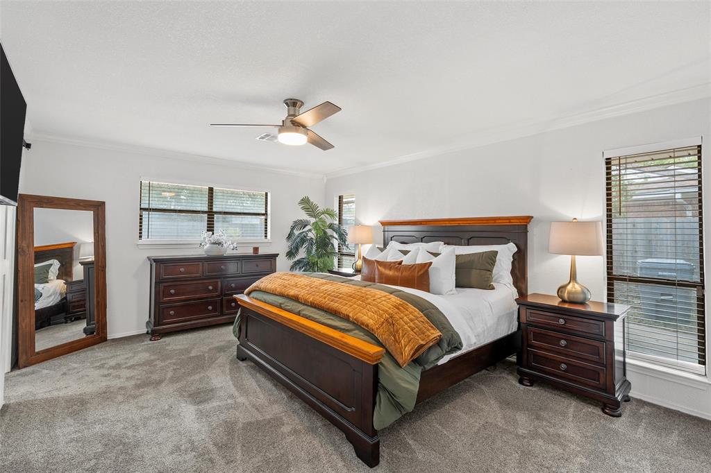 5704 Silver Lake Circle Waco, TX 76710 - Photo 20 of 36 a bedroom with a bed and a chandelier