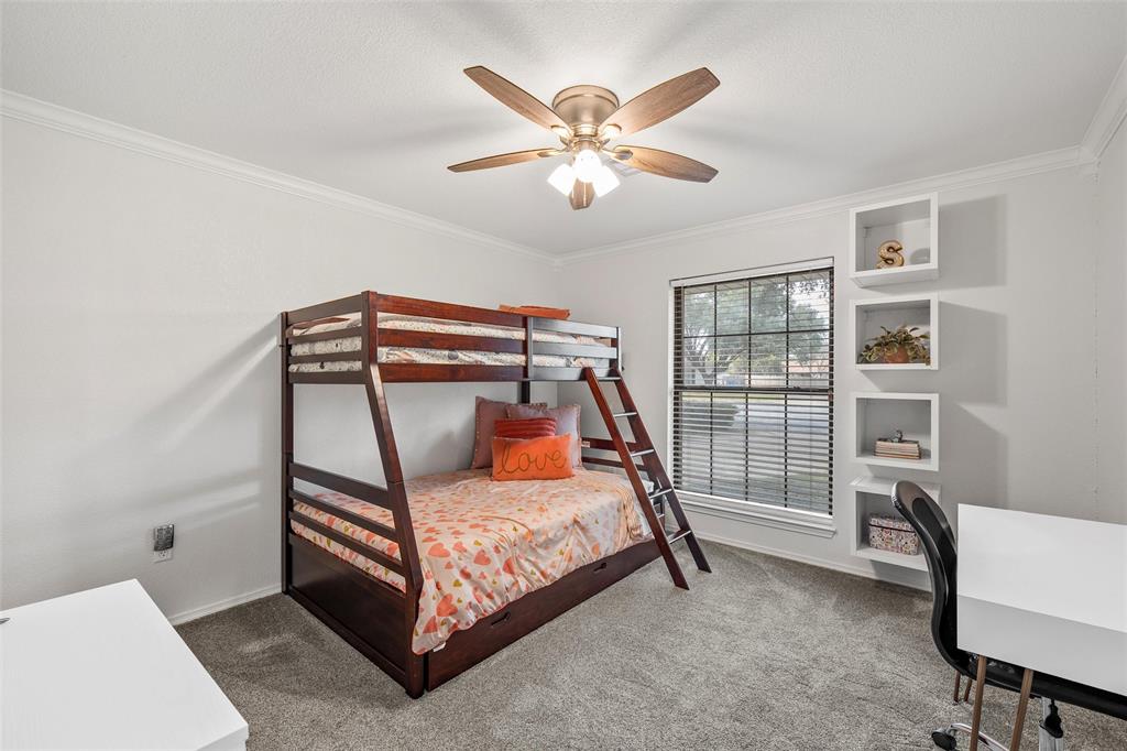 5704 Silver Lake Circle Waco, TX 76710 - Photo 26 of 36 a bedroom with a bed and a chandelier