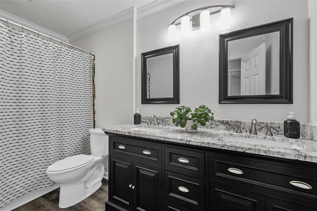 5704 Silver Lake Circle Waco, TX 76710 - Photo 28 of 36 a bathroom with a granite countertop toilet sink and mirror