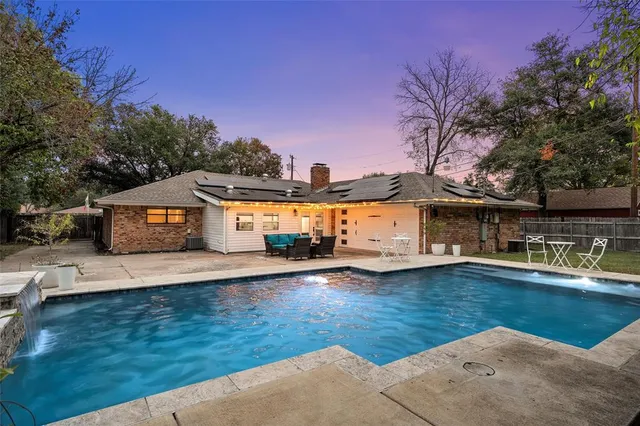 a front view of a house with swimming pool