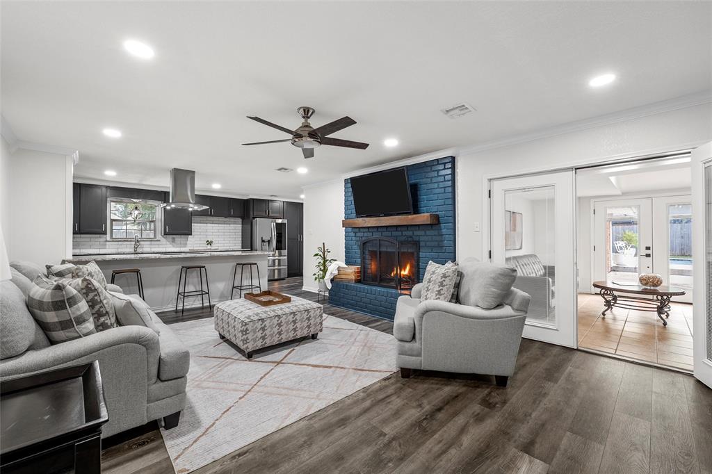 5704 Silver Lake Circle Waco, TX 76710 - Photo 10 of 36 a living room with furniture a fireplace and a flat screen tv