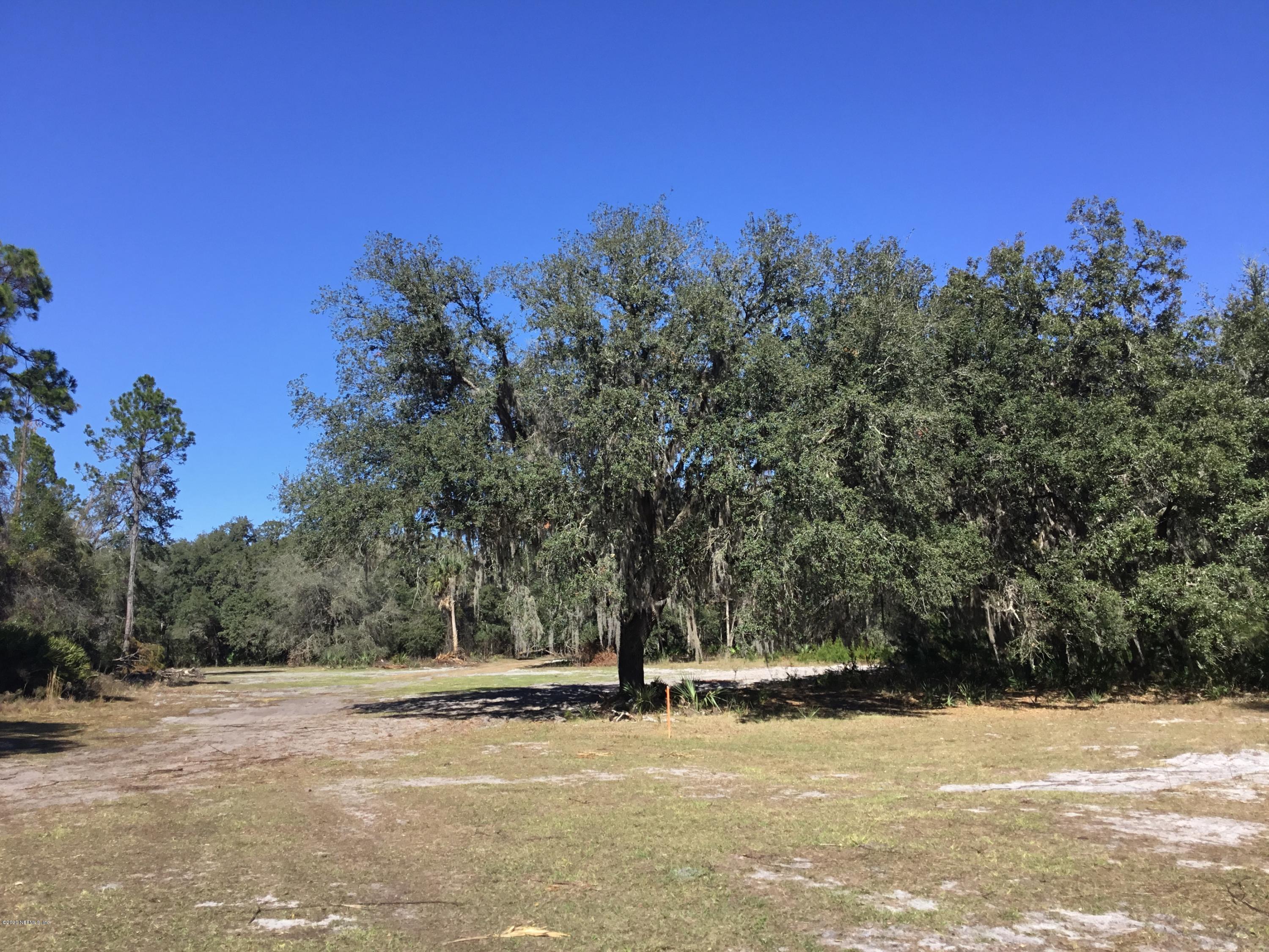 8 Georgetown Shortcut Road Crescent City, FL 32112 - Photo 5 of 10 a view of a field with trees in the background