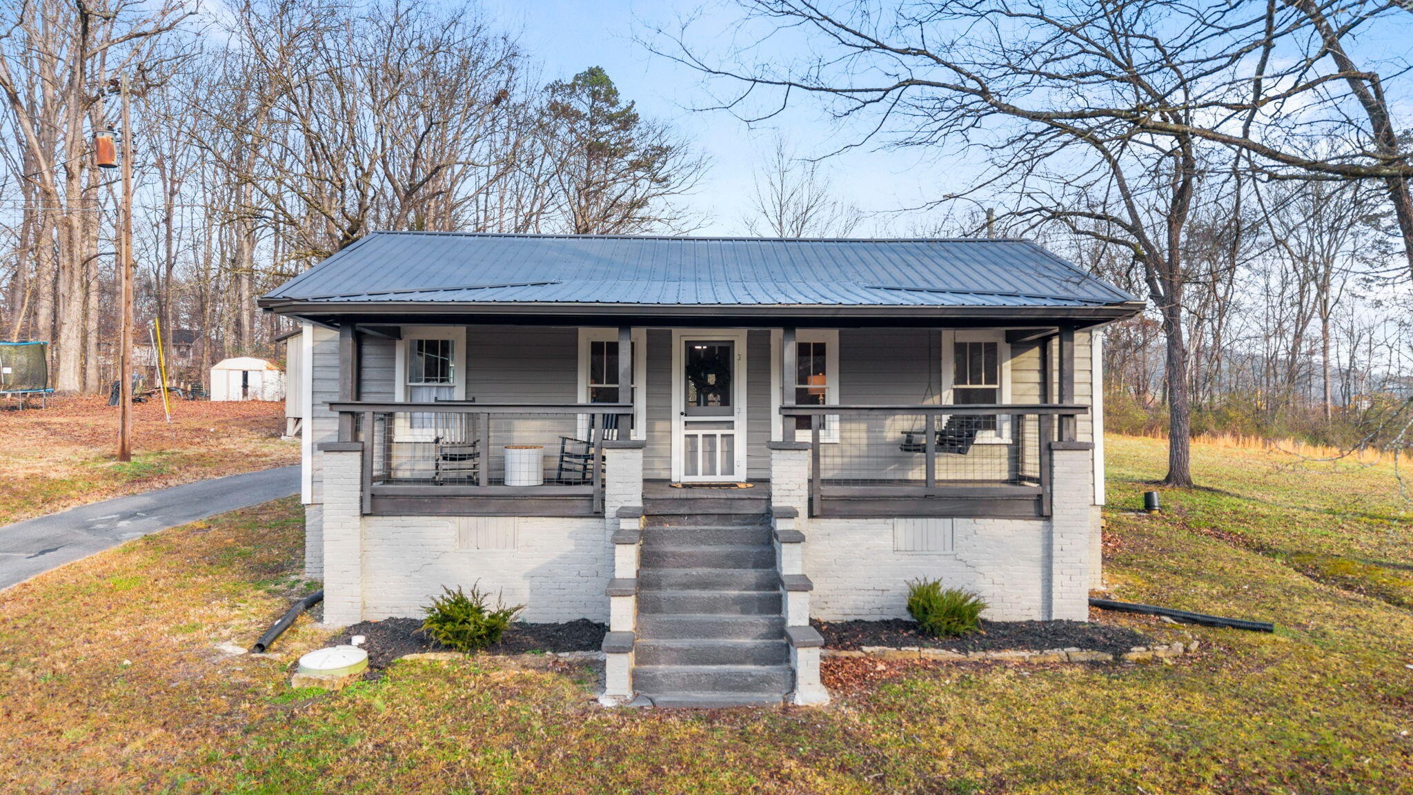 1210 Old Englewood Road Athens, TN 37303 - Photo 1 of 28 a front view of a house with garden