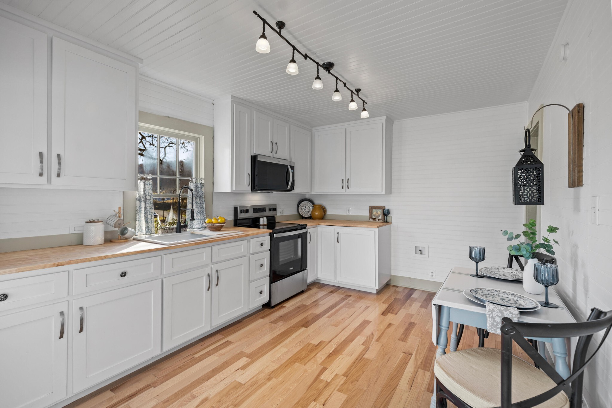 1210 Old Englewood Road Athens, TN 37303 - Photo 12 of 28 a kitchen with sink a microwave and cabinets