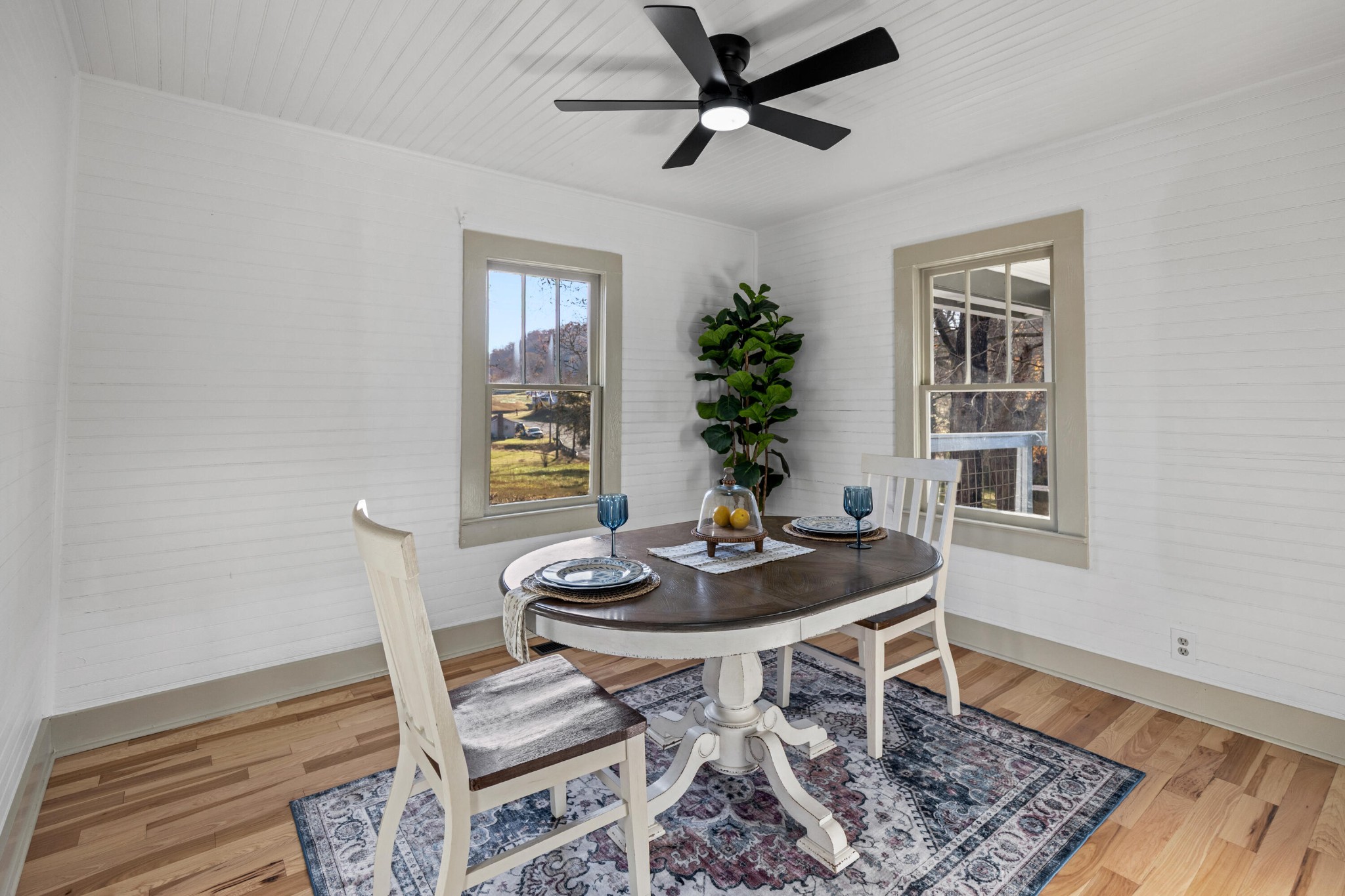 1210 Old Englewood Road Athens, TN 37303 - Photo 14 of 28 a dining room with wooden floor and a potted plant