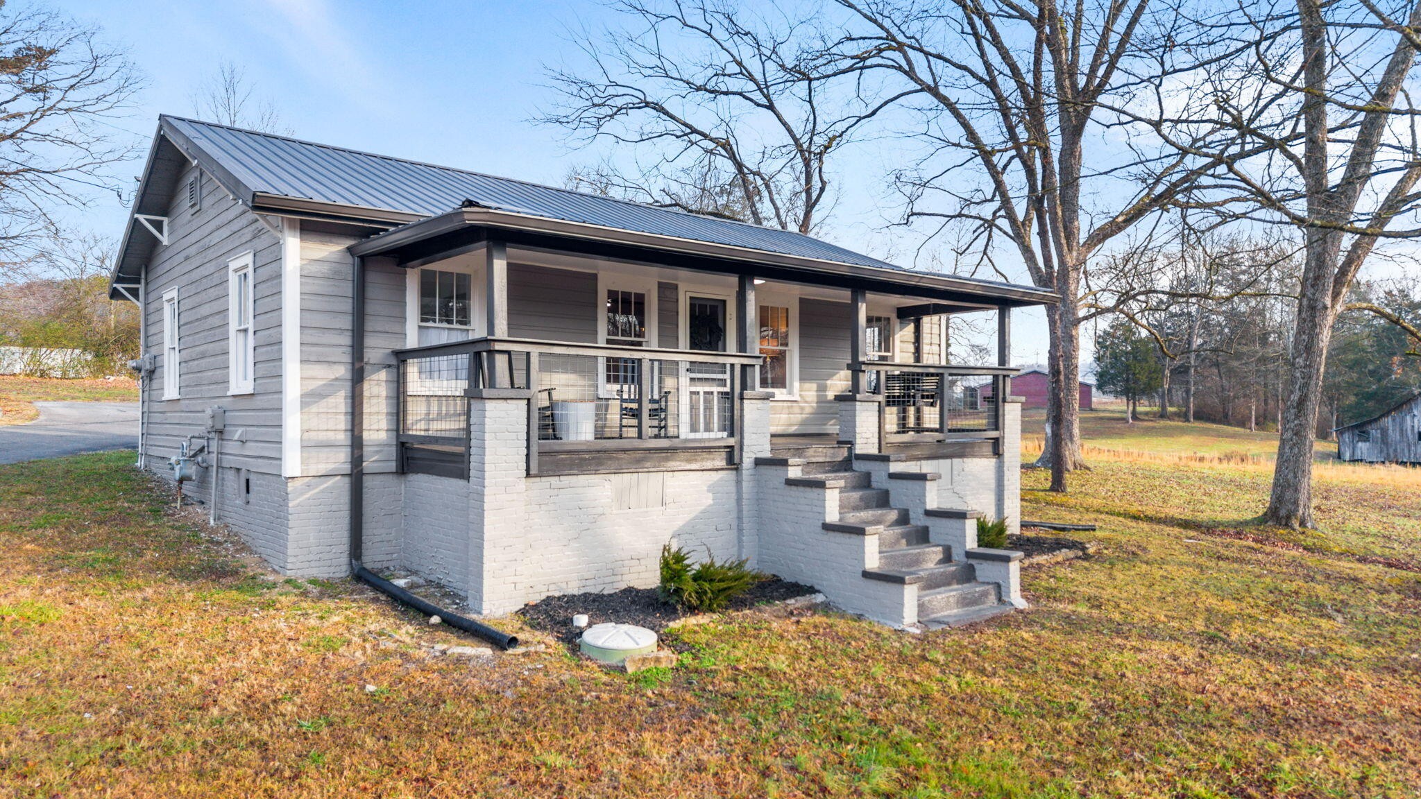 1210 Old Englewood Road Athens, TN 37303 - Photo 2 of 28 a front view of a house with a patio