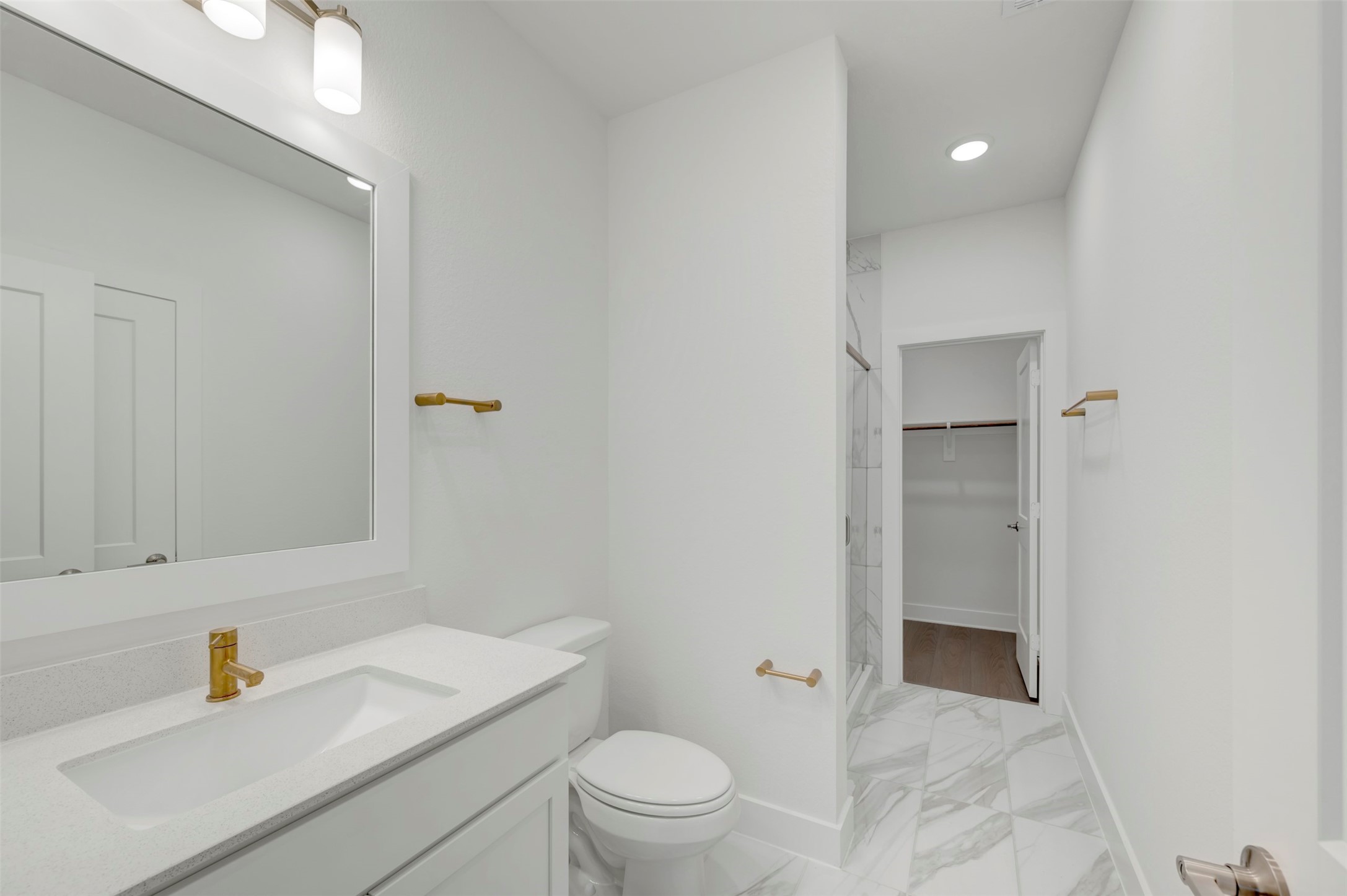 467 6th Street Magnolia, TX 77355 - Photo 23 of 50 a bathroom with a sink a toilet and shower